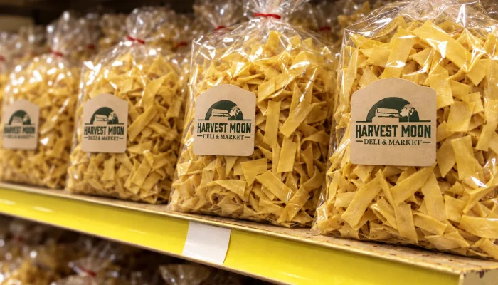 Bags of Harvest Moon Deli & Market Amish egg noodles on a store shelf